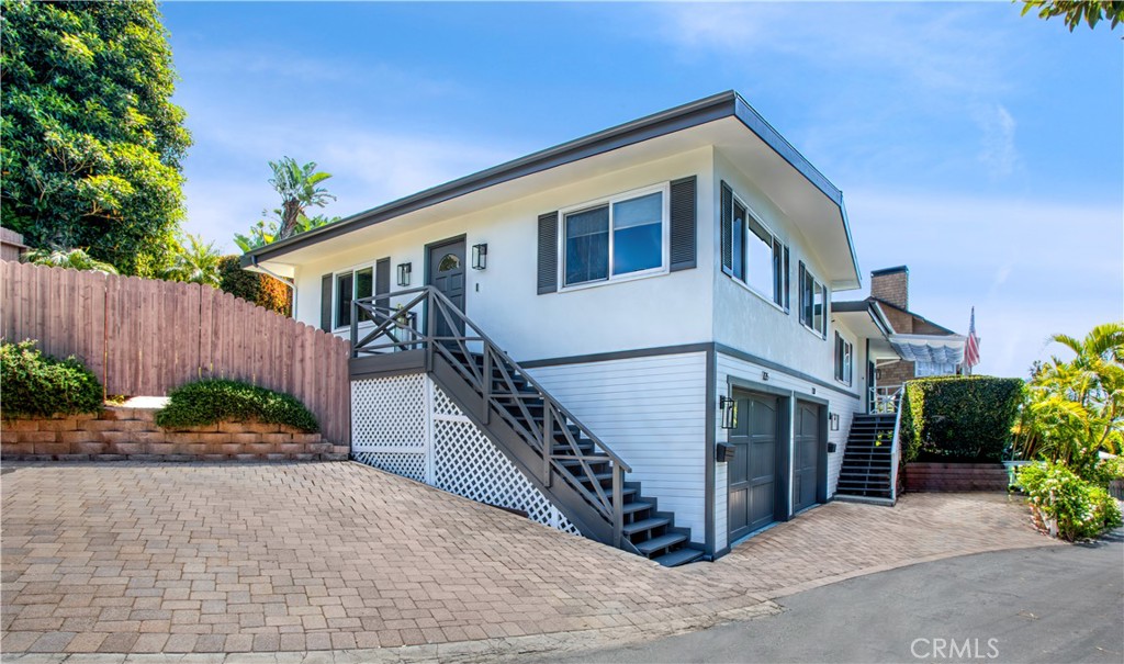 737 Griffith Way Laguna Beach, CA 92651 - Photo 22 of 25 a view of a house with wooden fence next to a yard