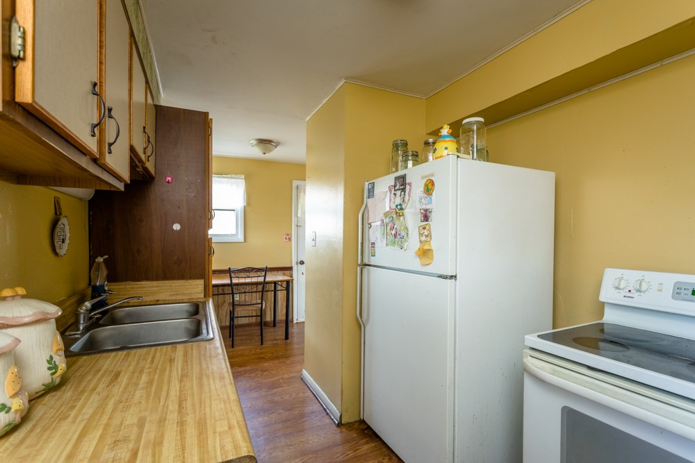 1450 Clover Hill Road Dayton, VA 22821 - Photo 3 of 16 a kitchen with a refrigerator and a stove top oven