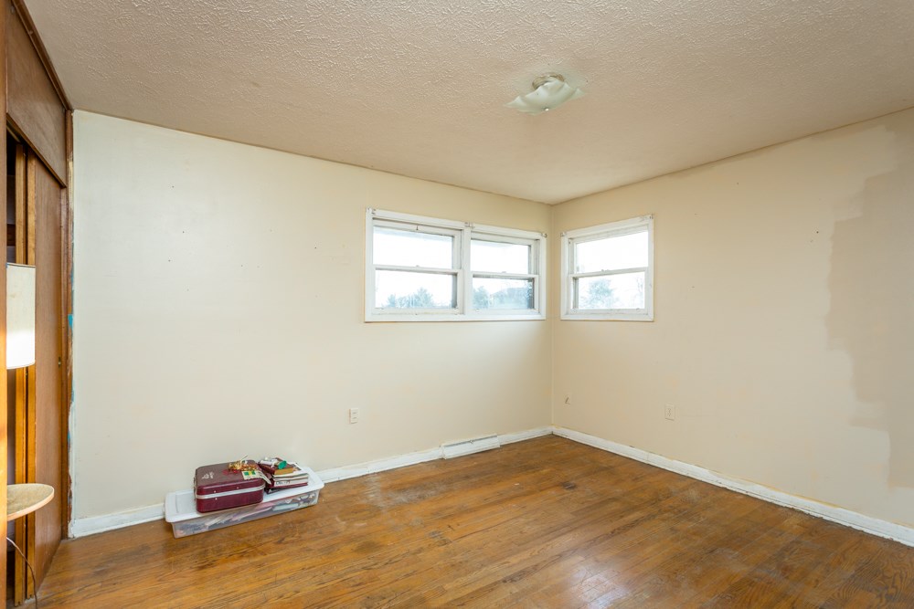 1450 Clover Hill Road Dayton, VA 22821 - Photo 7 of 16 a view of empty room with wooden floor and fan