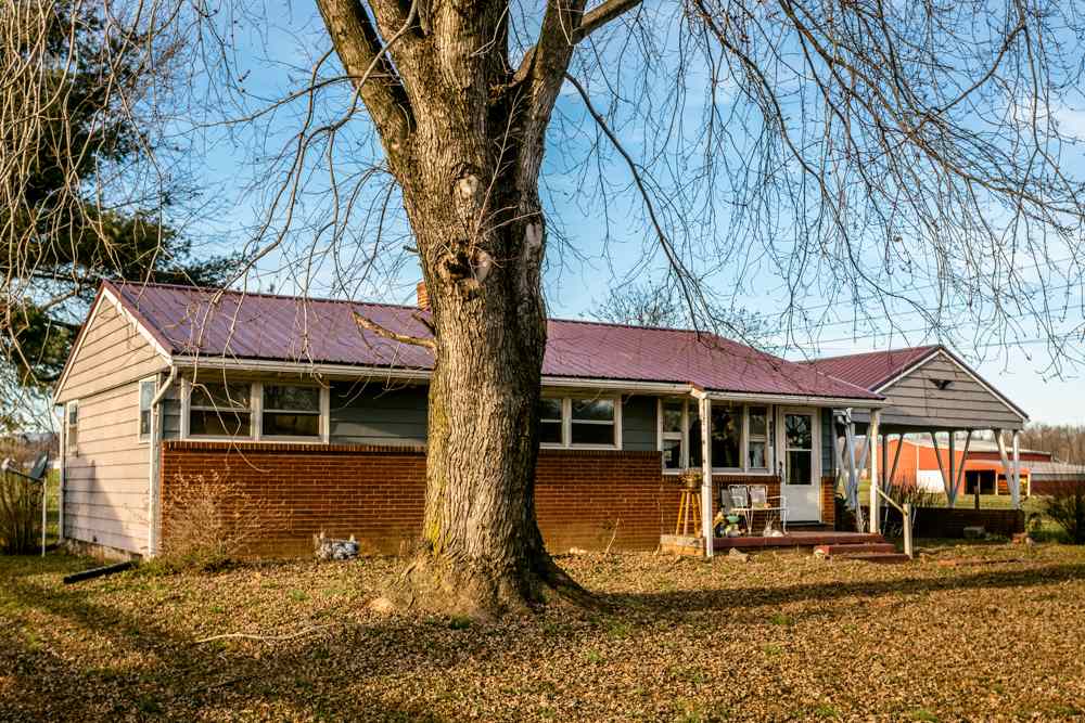 1450 Clover Hill Road Dayton, VA 22821 - Photo 10 of 16 a front view of a house with a yard
