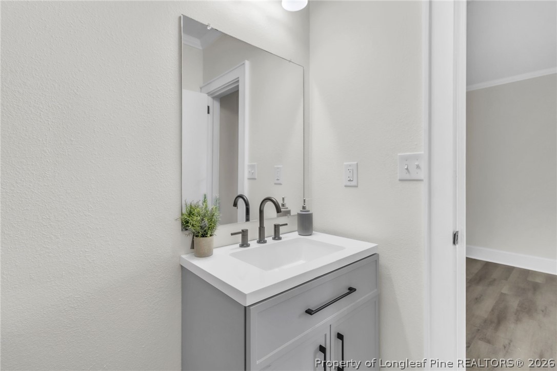 203 Trinity Street Fairmont, NC 28340 - Photo 29 of 34 a bathroom with a sink and a mirror