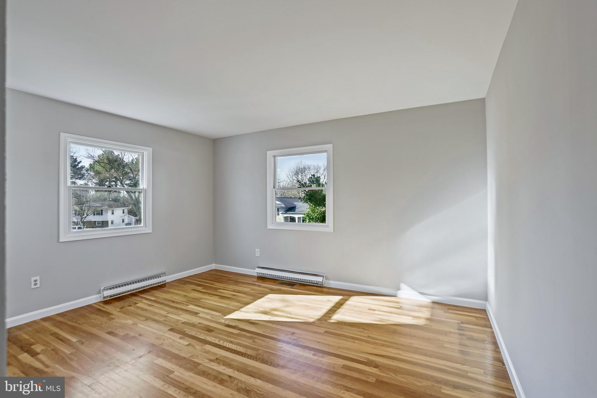 600 East Poplar Road Sterling, VA 20164 - Photo 12 of 32 a view of empty room with wooden floor and fan