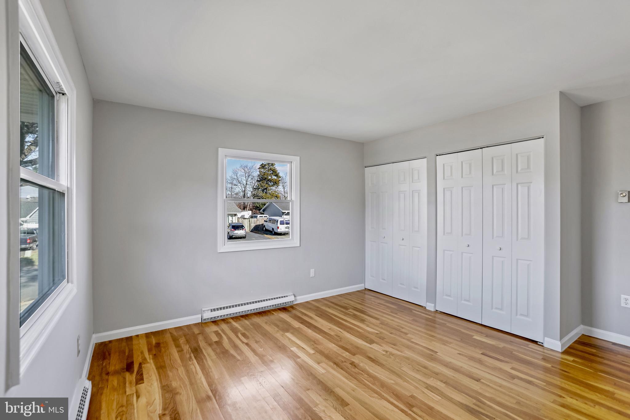 600 East Poplar Road Sterling, VA 20164 - Photo 15 of 32 a view of a room with wooden floor and bedroom