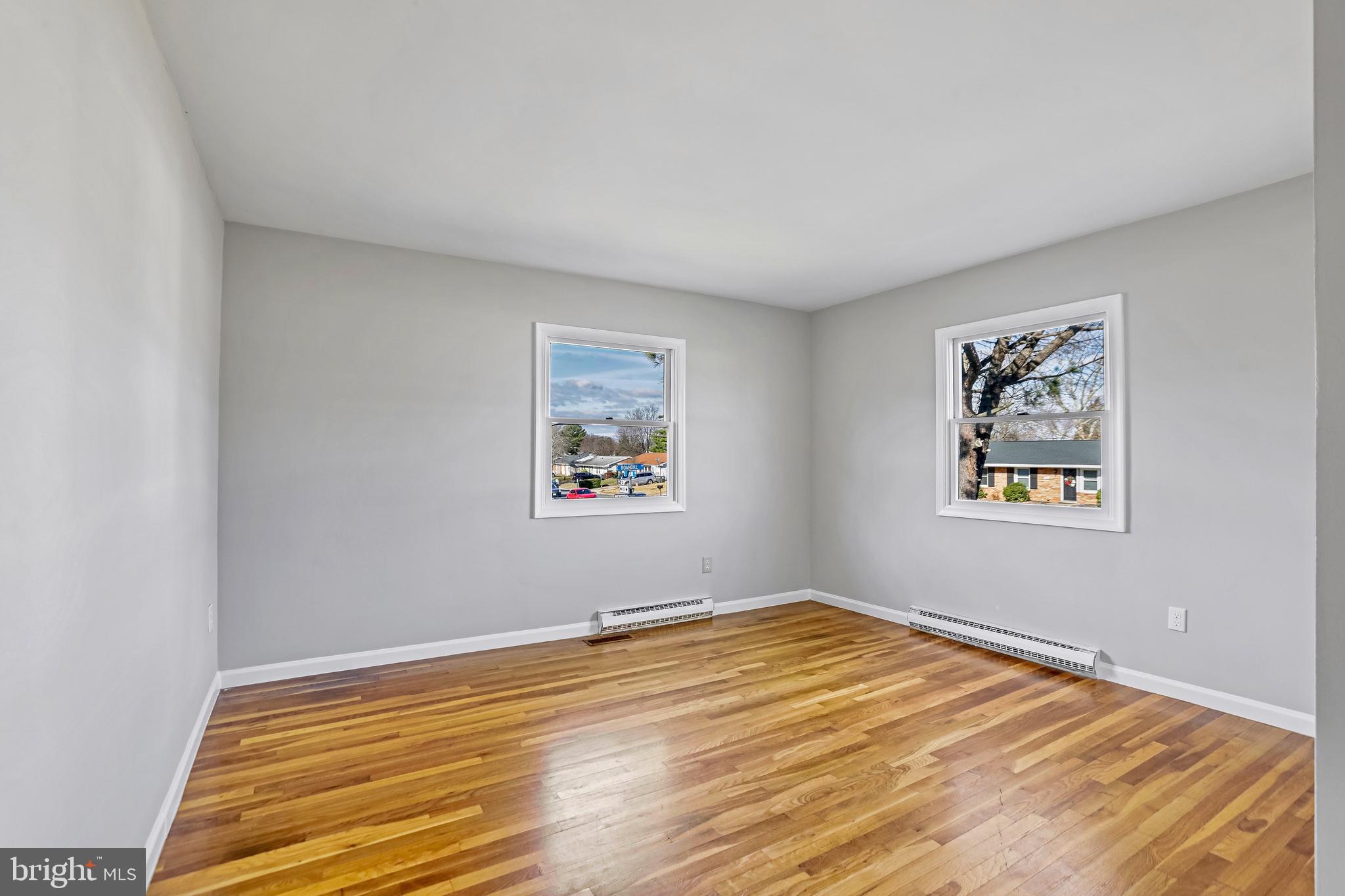 600 East Poplar Road Sterling, VA 20164 - Photo 16 of 32 a view of a room with wooden floor and window