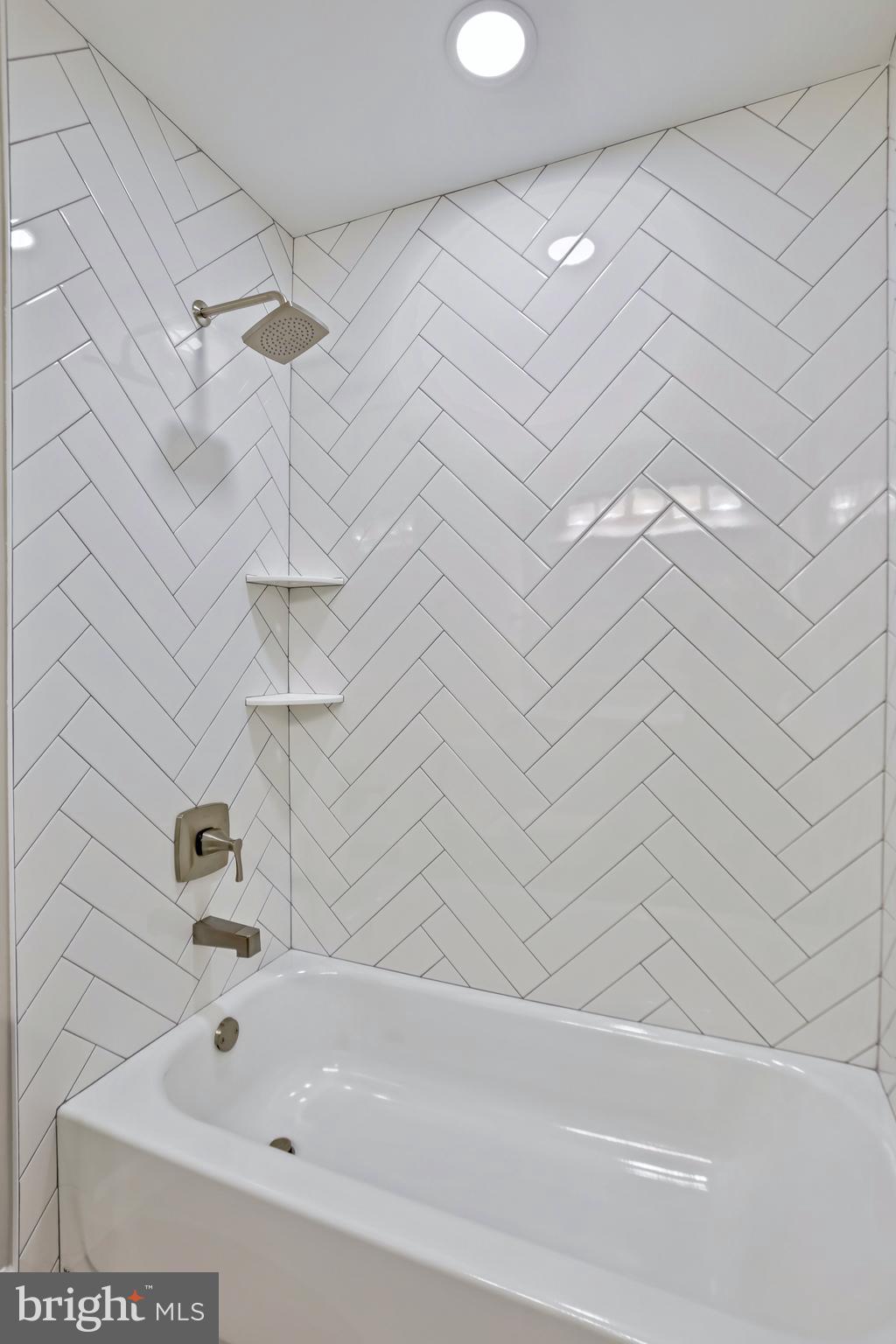 600 East Poplar Road Sterling, VA 20164 - Photo 19 of 32 a bathroom with a bathtub and a shower