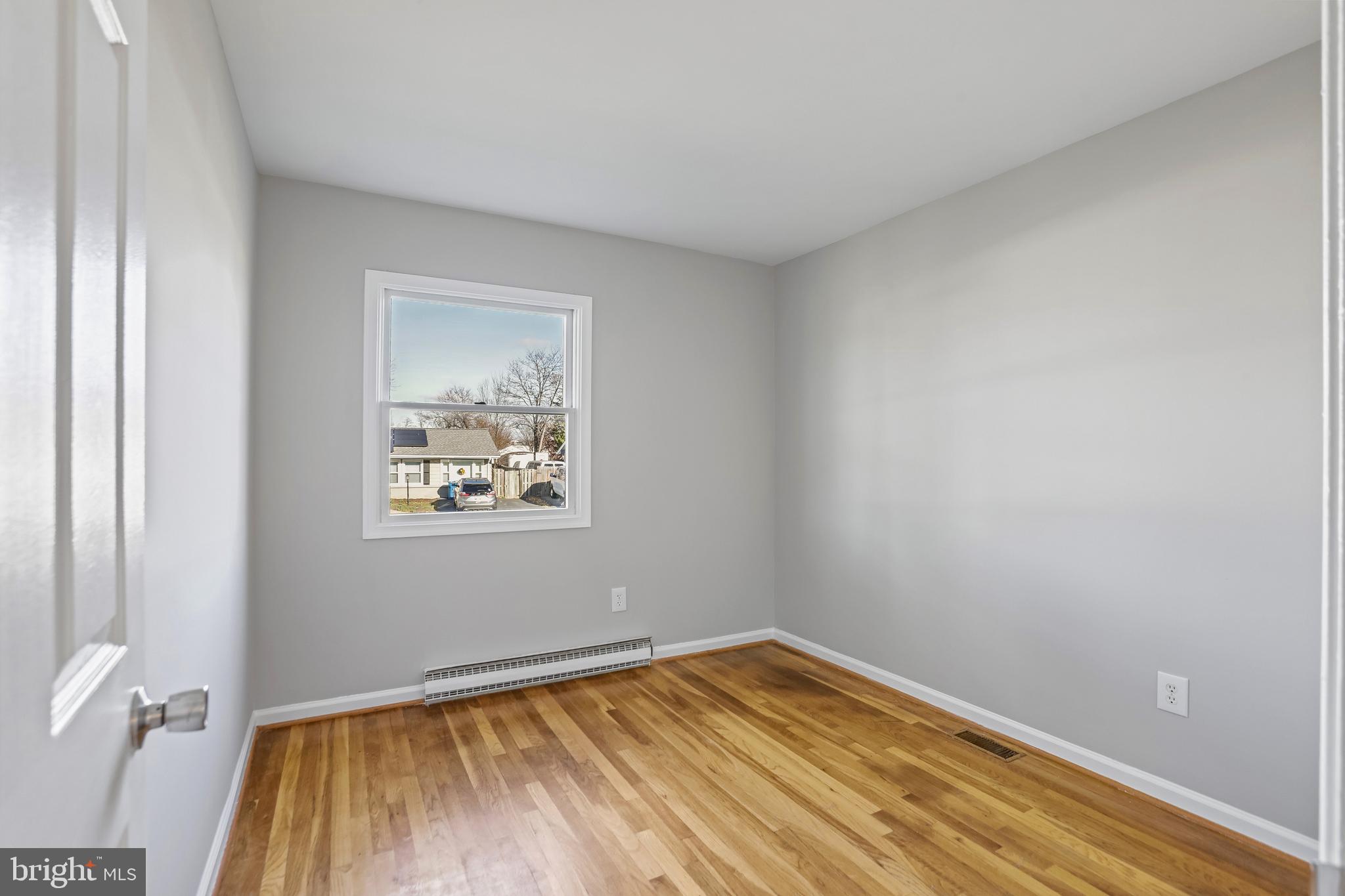 600 East Poplar Road Sterling, VA 20164 - Photo 20 of 32 a view of empty room with wooden floor and fan