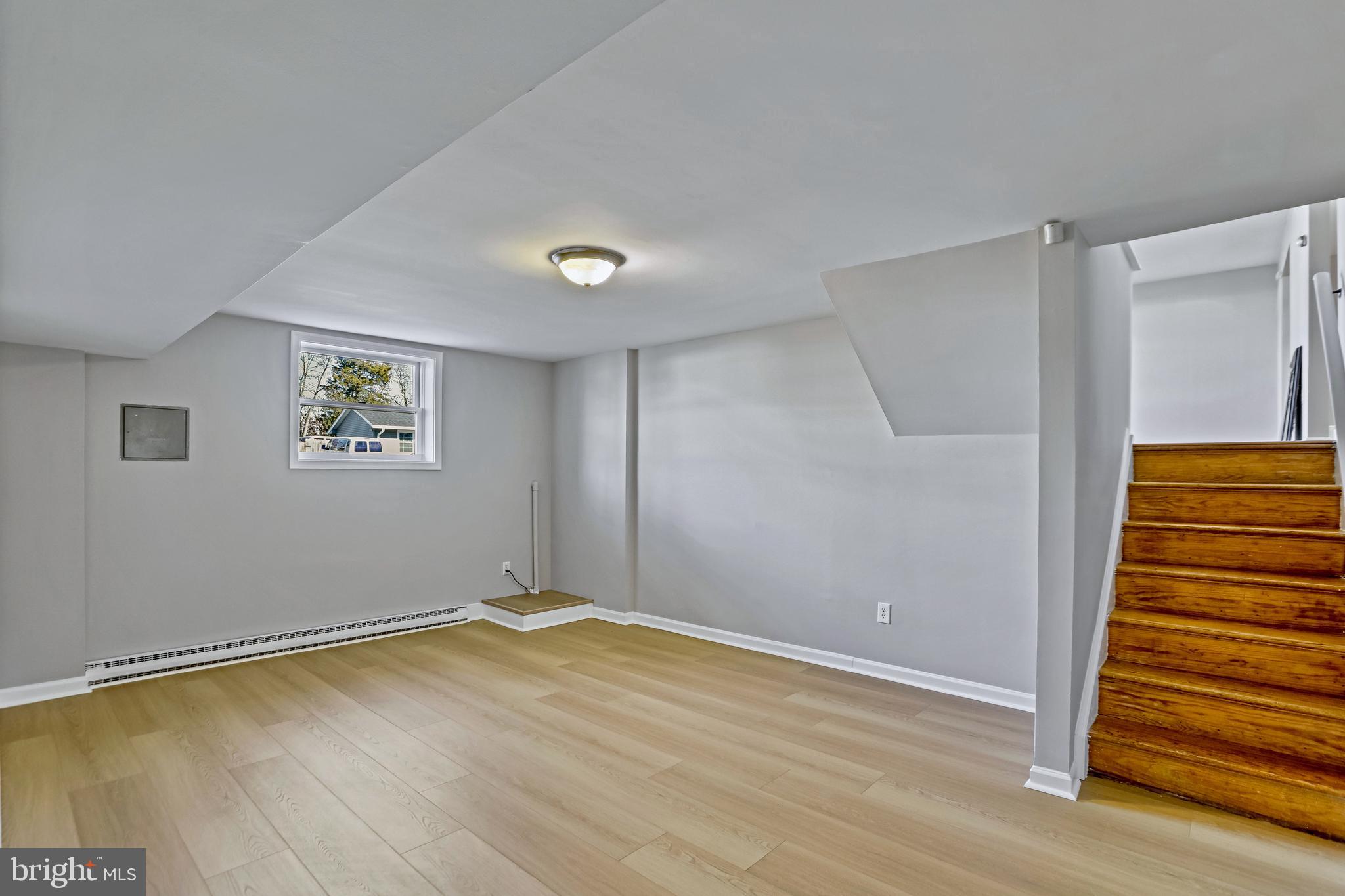 600 East Poplar Road Sterling, VA 20164 - Photo 21 of 32 wooden floor in an empty room with a window