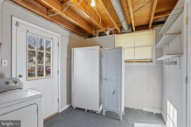 a view of walk in closet with window
