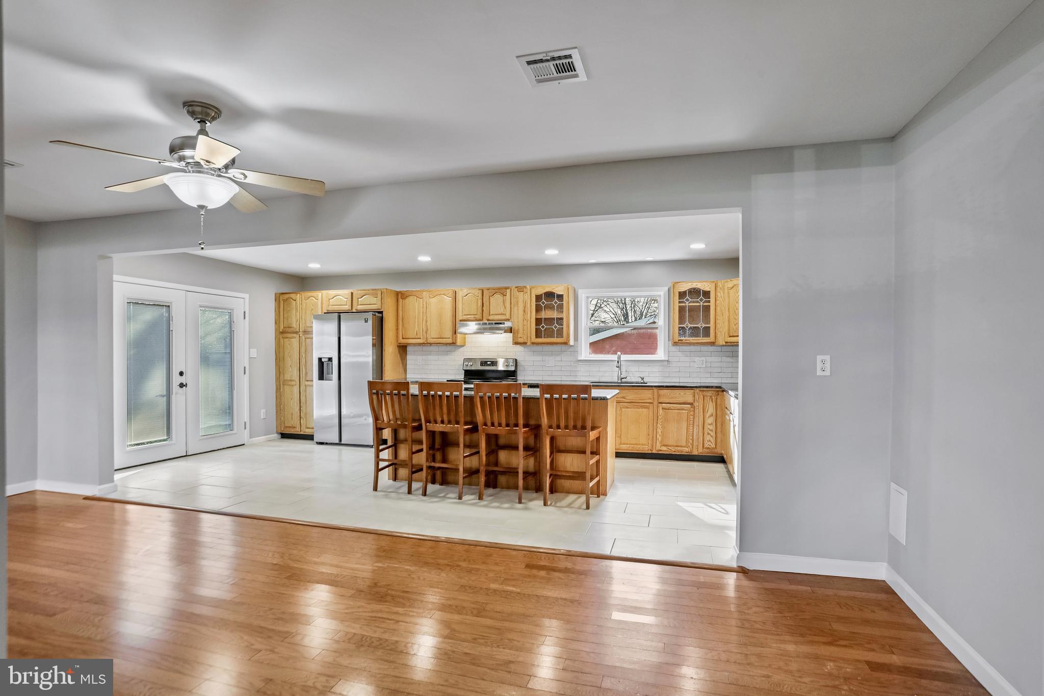600 East Poplar Road Sterling, VA 20164 - Photo 7 of 32 a view of a dining room with furniture window and wooden floor