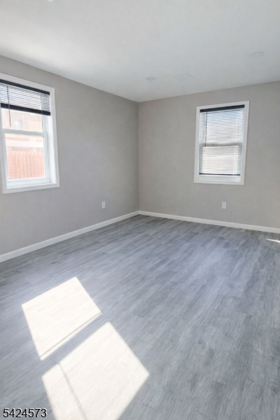 206 Talmage Avenue Bound Brook, NJ 08805 - Photo 11 of 18 an empty room with windows