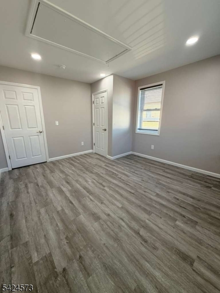 206 Talmage Avenue Bound Brook, NJ 08805 - Photo 14 of 18 wooden floor in an empty room with a window