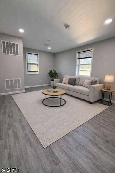 206 Talmage Avenue Bound Brook, NJ 08805 - Photo 3 of 18 a living room with furniture and a wooden floor