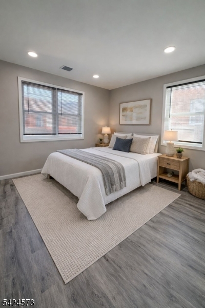206 Talmage Avenue Bound Brook, NJ 08805 - Photo 9 of 18 a spacious bedroom with a large bed and windows