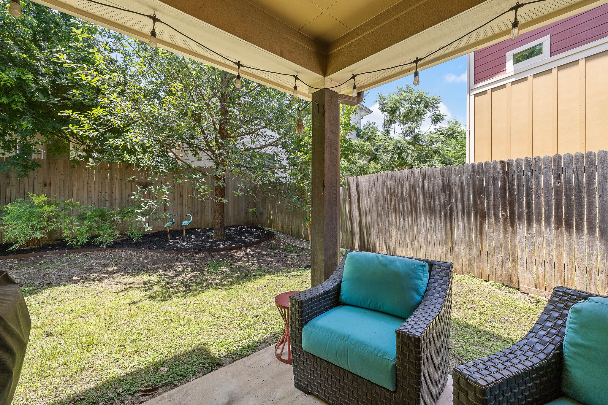 6708 Menchaca Road, Unit 10 Austin, TX 78745 - Photo 26 of 28 Covered patio with string lighting and concrete flooring
