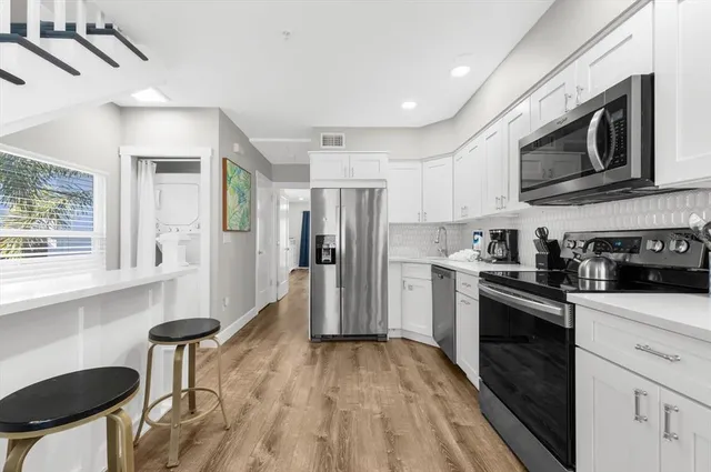 a view of a balcony with wooden floor