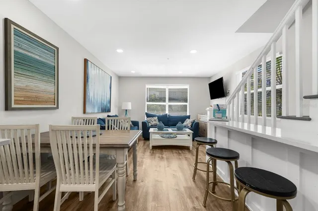a kitchen with a refrigerator and a stove top oven