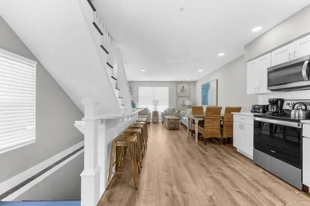 a kitchen with a refrigerator stove and microwave