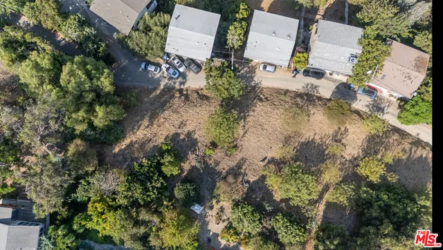 an aerial view of residential house with outdoor space