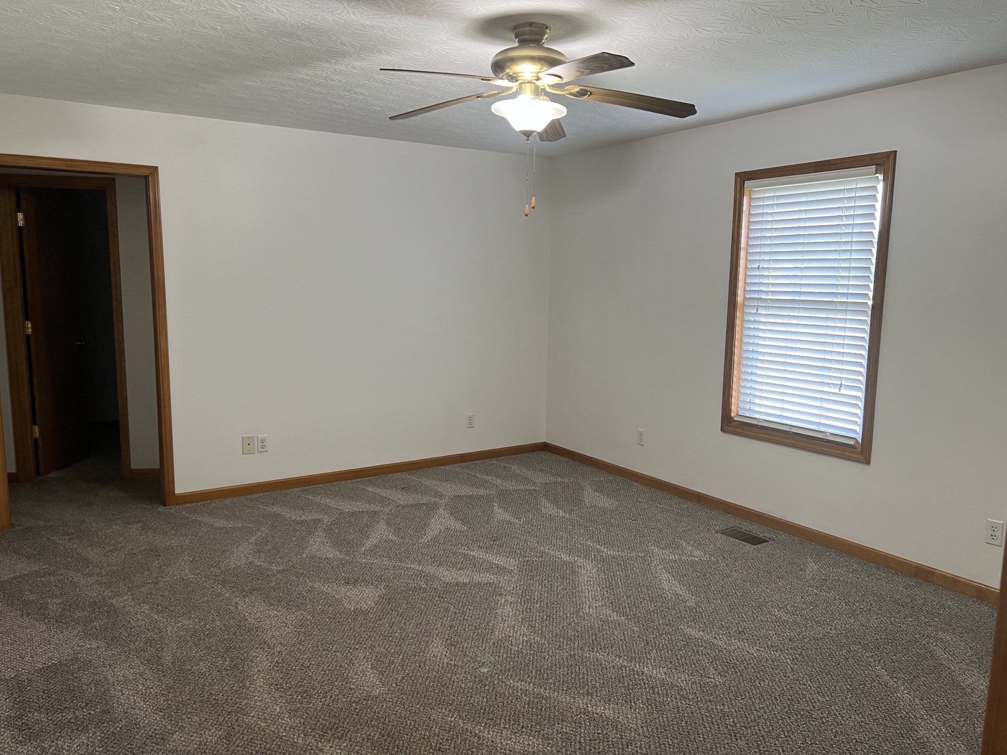 152 Bosham Road Westmoreland, TN 37186 - Photo 2 of 53 an empty room with windows and fan