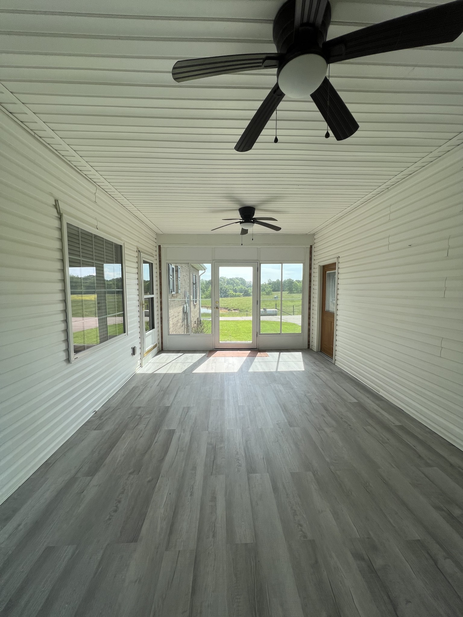152 Bosham Road Westmoreland, TN 37186 - Photo 26 of 53 a view of empty room with wooden floor and fan
