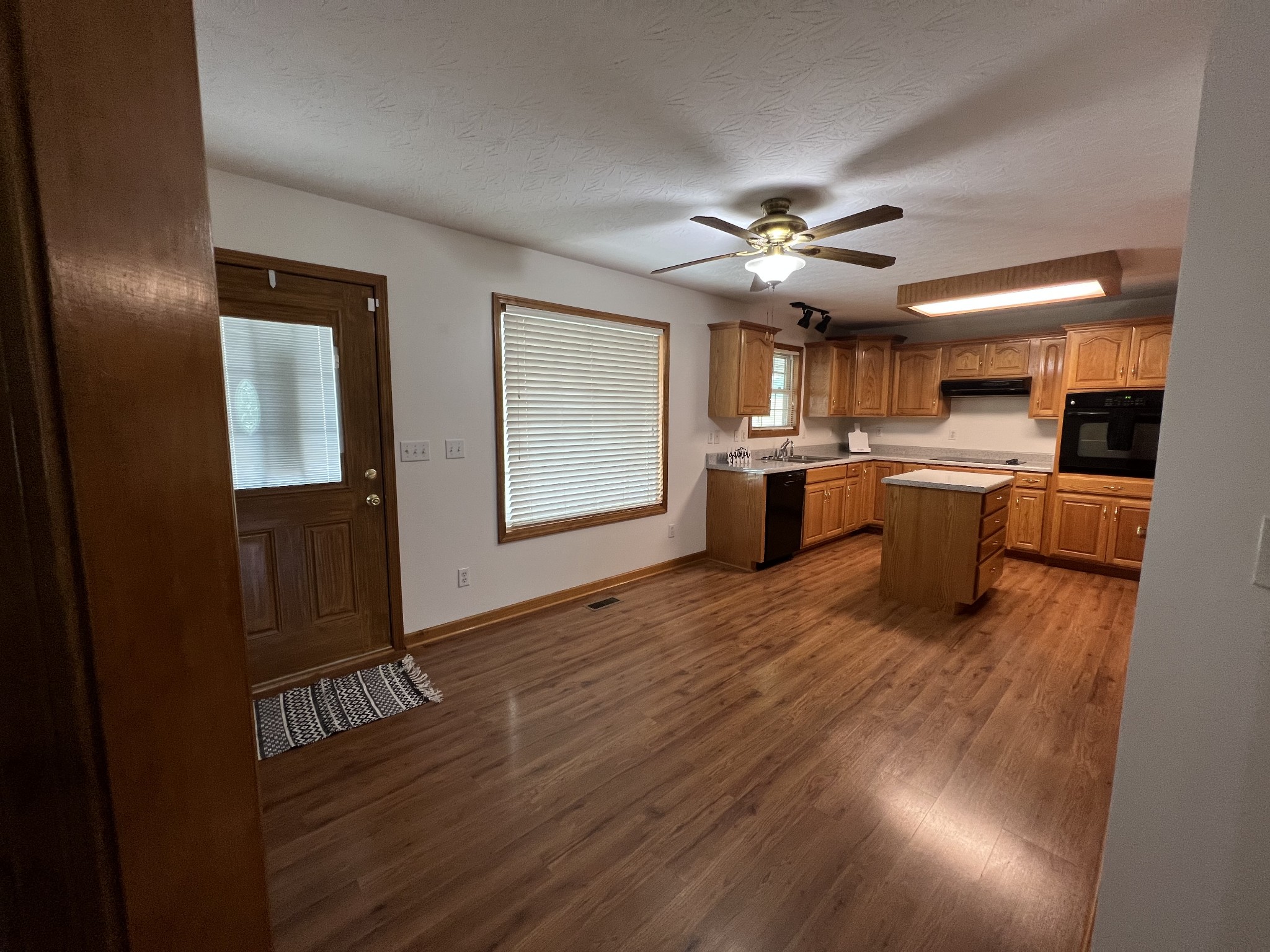 152 Bosham Road Westmoreland, TN 37186 - Photo 28 of 53 a view of a kitchen with a sink cabinets and wooden floor