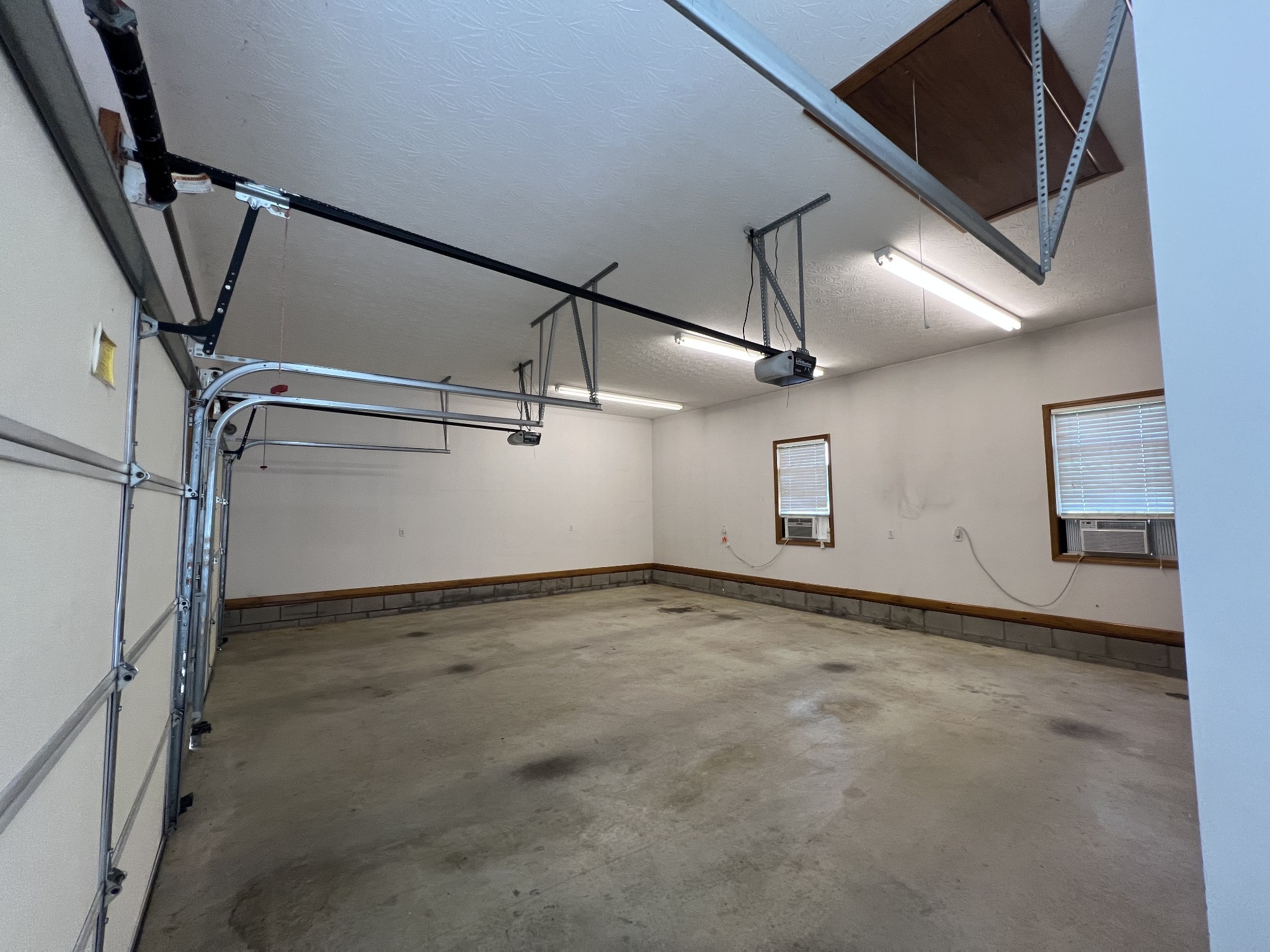 152 Bosham Road Westmoreland, TN 37186 - Photo 49 of 53 an empty room with wooden floor and windows