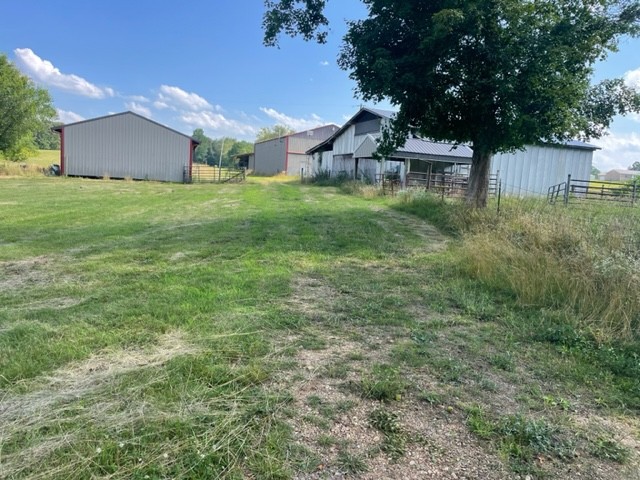 152 Bosham Road Westmoreland, TN 37186 - Photo 53 of 53 a backyard of a house with lots of green space and plants