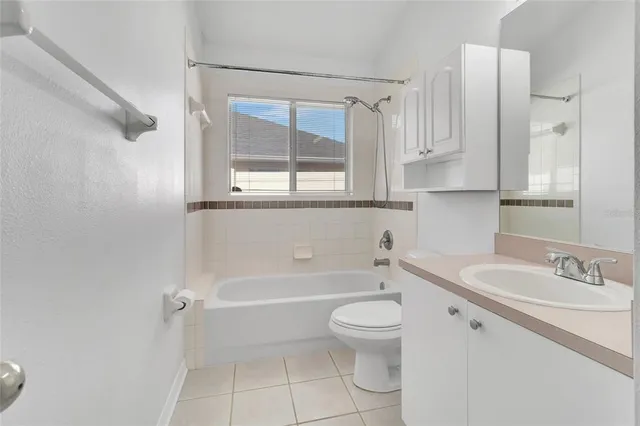 a bathroom with a sink a toilet and a bathtub