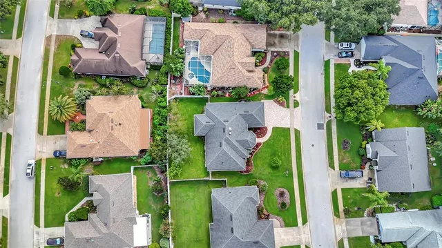 an aerial view of a house with a garden and plants