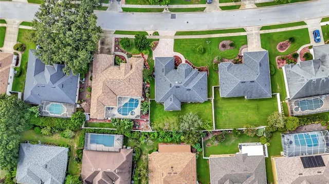 an aerial view of houses with outdoor space