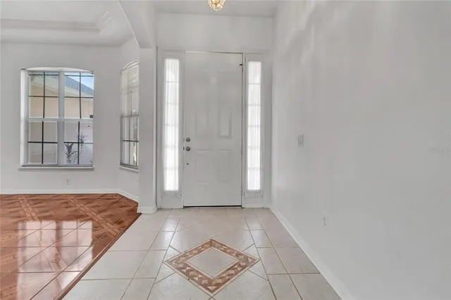 a view of bedroom and front door