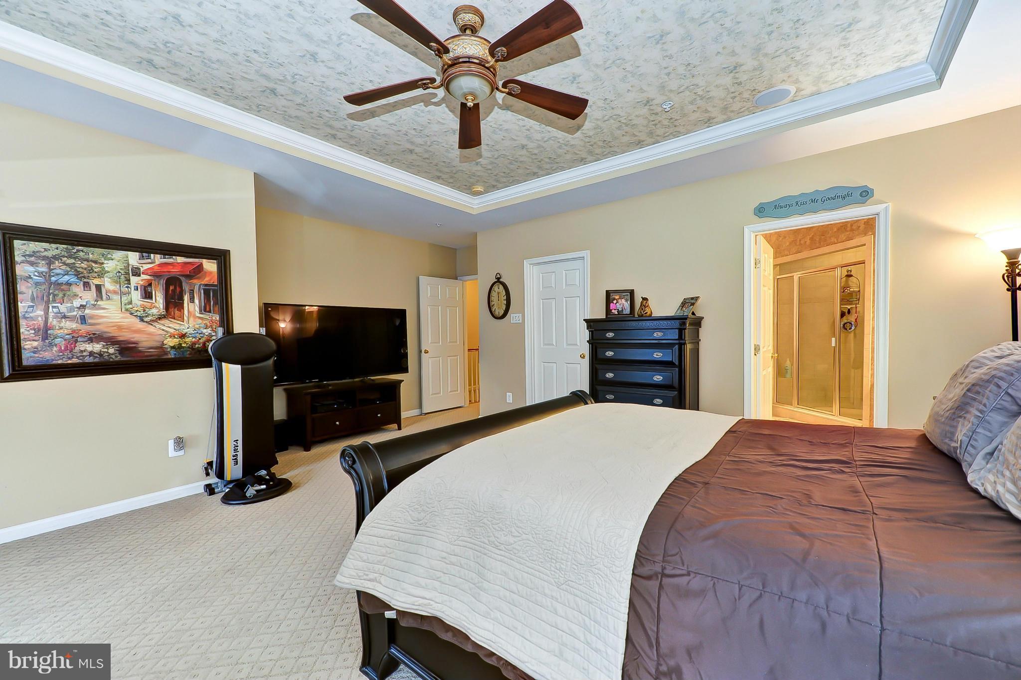 41888 Inspiration Terrace Aldie, VA 20105 - Photo 26 of 30 a bedroom with a bed and a flat screen tv