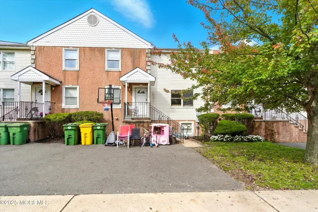 a front view of a house with a garage