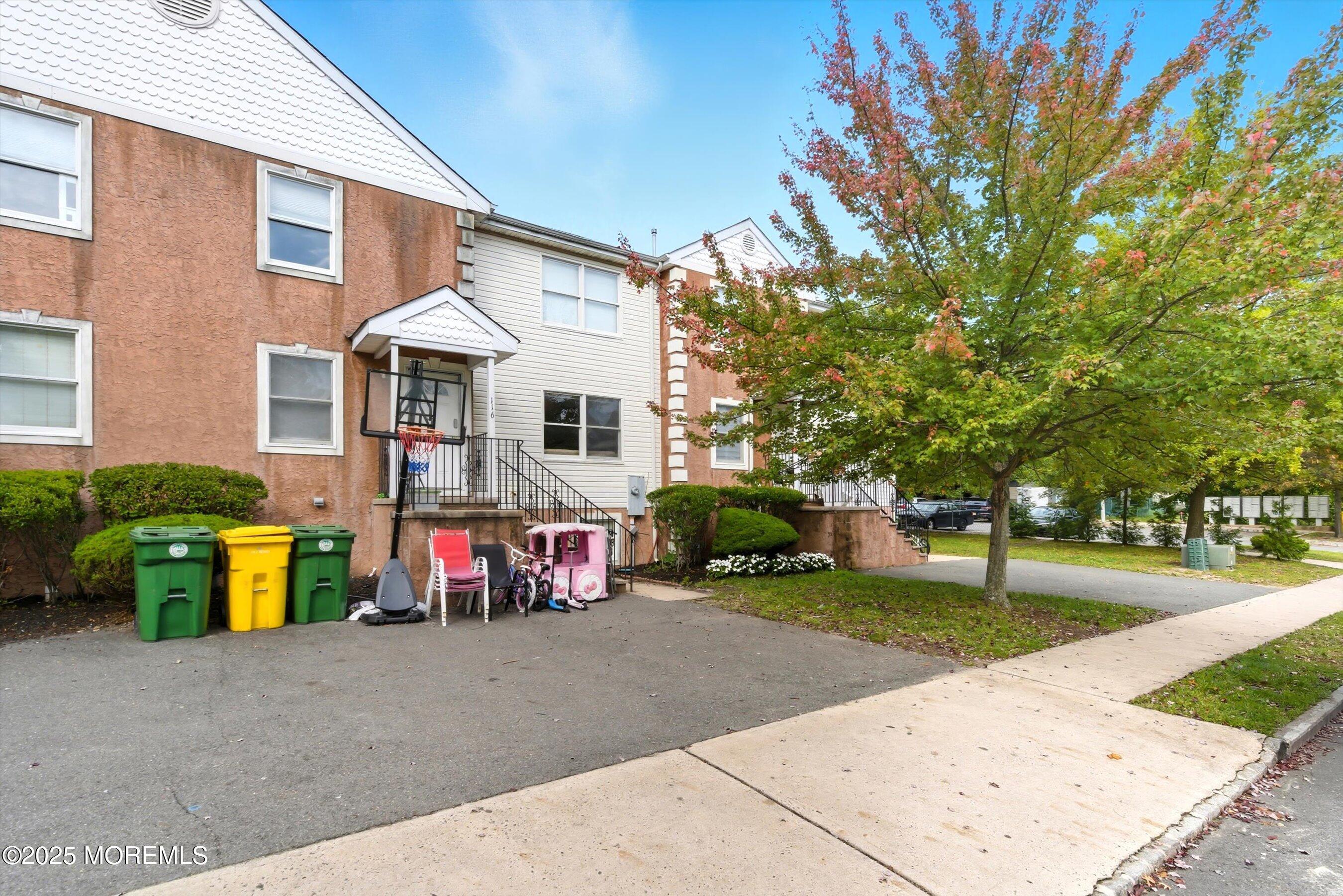 116 Ricky Lane Lakewood, NJ 08701 - Photo 2 of 9 a front view of a house with garden