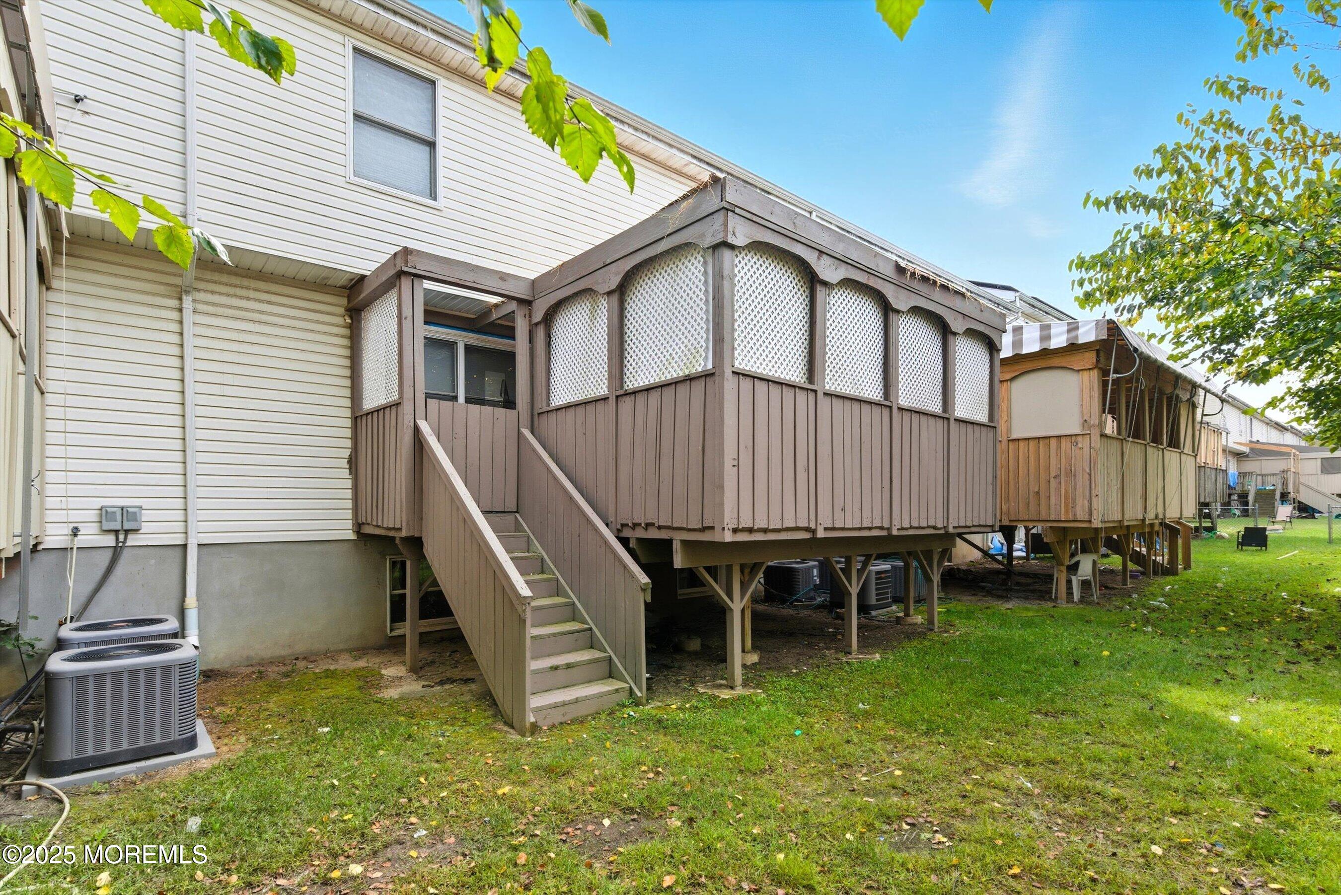 116 Ricky Lane Lakewood, NJ 08701 - Photo 6 of 9 a backyard of a house with table and chairs