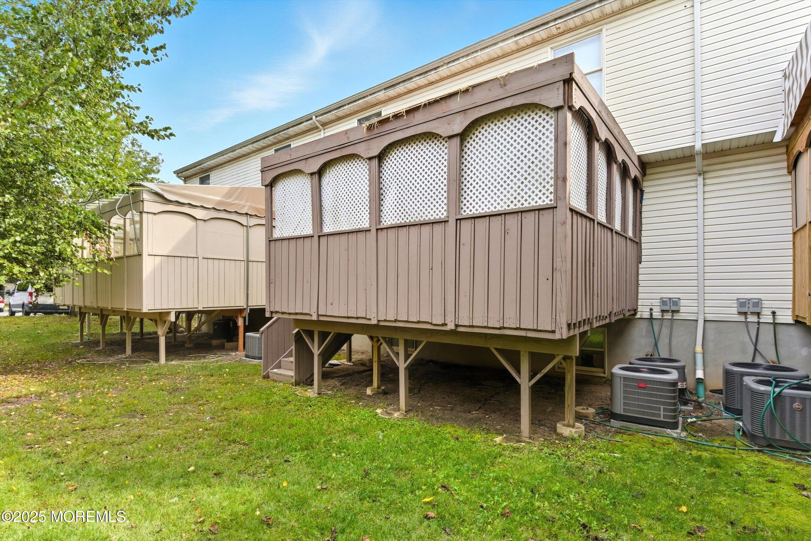 116 Ricky Lane Lakewood, NJ 08701 - Photo 7 of 9 a backyard of a house with table and chairs