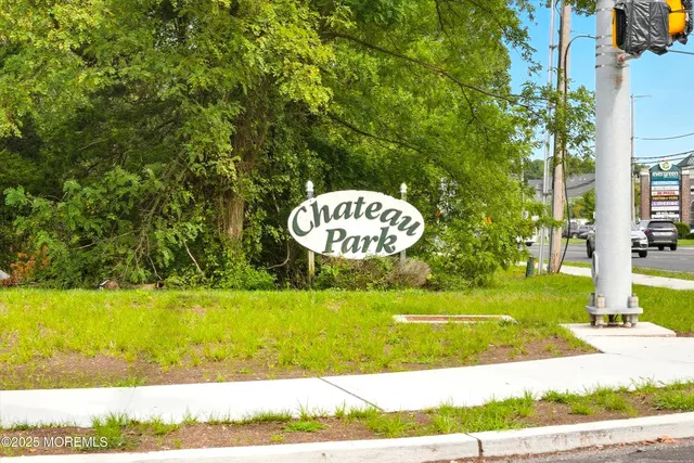 a view of a swimming pool with a yard