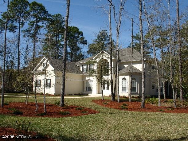 11778 Mandarin Road Jacksonville, FL 32223 - Photo 3 of 31 a front view of a house with a yard and entertaining space