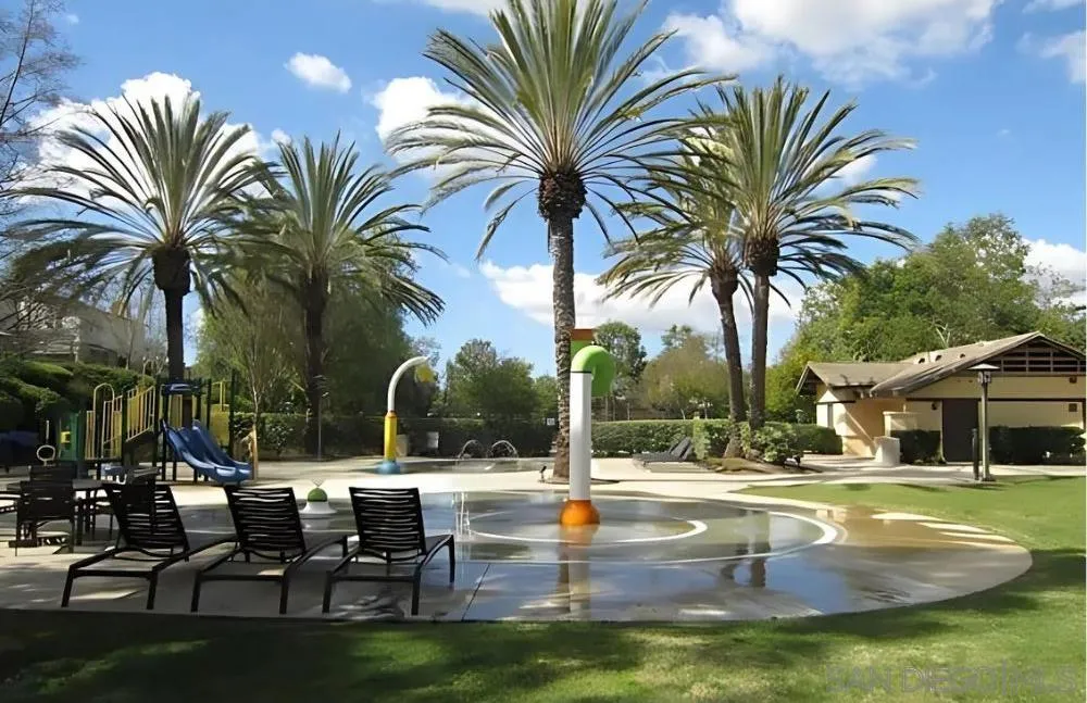 6 Reston Way Ladera Ranch, CA 92694 - Photo 36 of 39 a view of a swimming pool with a table and chairs