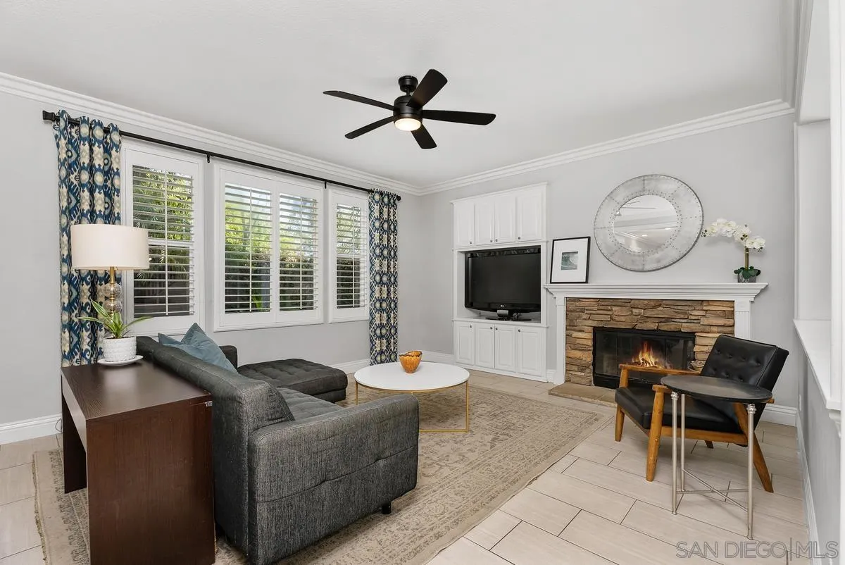 6 Reston Way Ladera Ranch, CA 92694 - Photo 6 of 39 a living room with furniture a fireplace and a flat screen tv