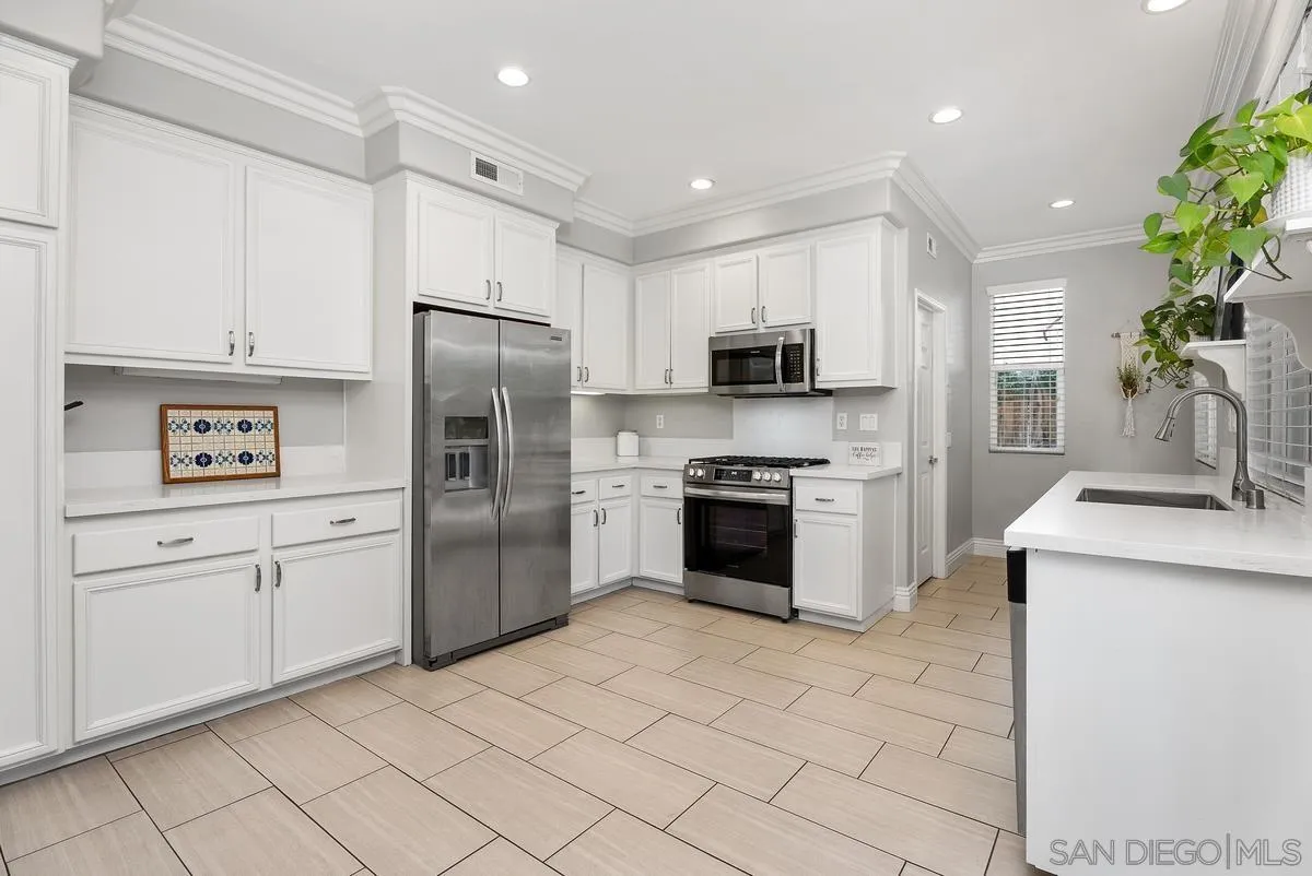 6 Reston Way Ladera Ranch, CA 92694 - Photo 8 of 39 a kitchen with granite countertop a refrigerator stove and sink