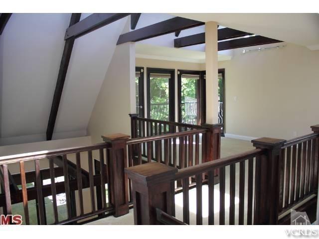 10386 Rochester Avenue Los Angeles, CA 90024 - Photo 13 of 18 a view of staircase with railing and white walls