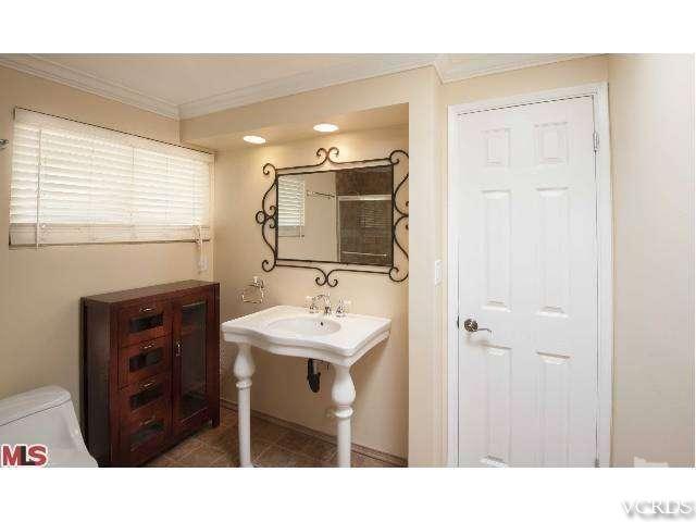 10386 Rochester Avenue Los Angeles, CA 90024 - Photo 18 of 18 a bathroom with a sink a toilet and mirror