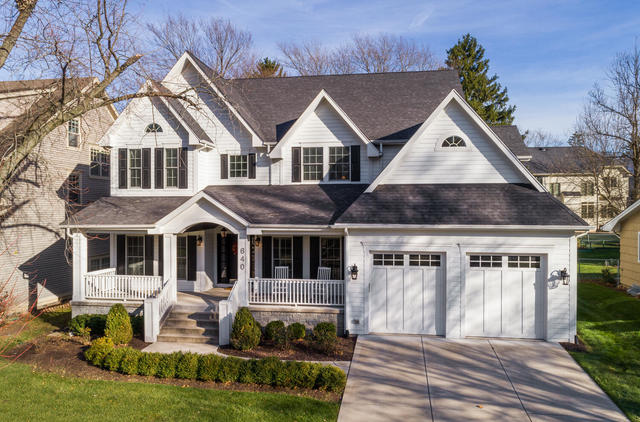 640 Wellner Road Naperville, IL 60540 - Photo 2 of 48 a view of a white house with a yard plants and large tree