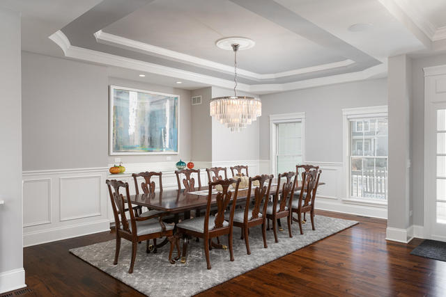 640 Wellner Road Naperville, IL 60540 - Photo 16 of 48 a view of a a dining room with furniture window and wooden floor