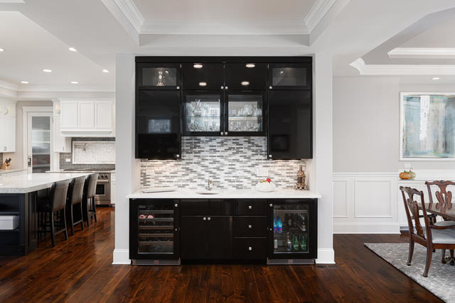 640 Wellner Road Naperville, IL 60540 - Photo 17 of 48 a kitchen with a wooden floor and chairs