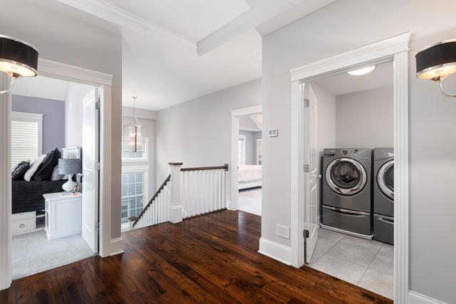 640 Wellner Road Naperville, IL 60540 - Photo 27 of 48 a view of a livingroom with a washer and dryer
