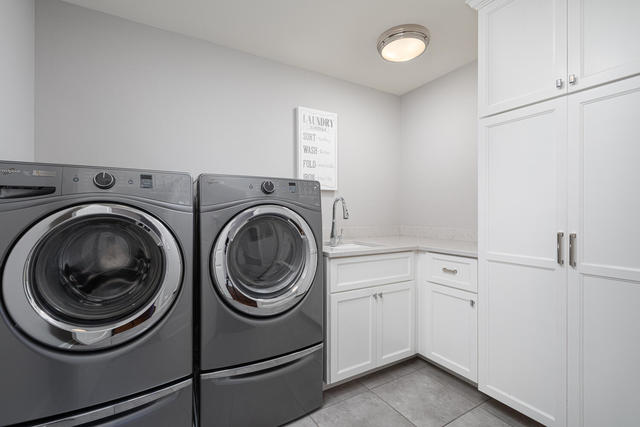 640 Wellner Road Naperville, IL 60540 - Photo 28 of 48 a utility room with sink dryer and washer