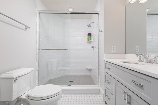640 Wellner Road Naperville, IL 60540 - Photo 34 of 48 a bathroom with a sink toilet and shower