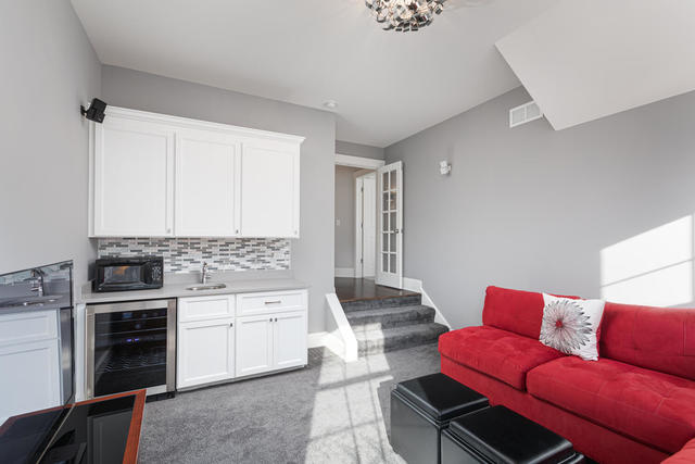 640 Wellner Road Naperville, IL 60540 - Photo 36 of 48 a room with furniture and a stove top oven